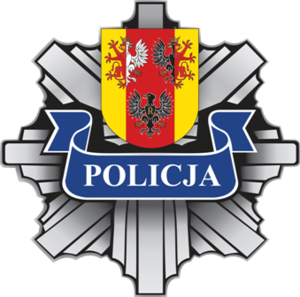 Blacha policyjna z napisem policja i herbem województwa łódzkiego.