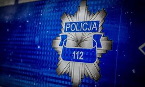 Napis Policja z numerem alarmowym 112.